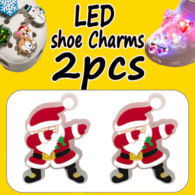 LED shoe charms with Santa Claus design on a yellow background