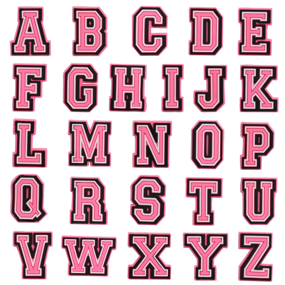 shoe charms Pink letters of the alphabet with black outlines on a white background