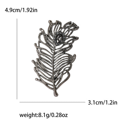 Silver leaf-shaped brooch with measurements and weight displayed on a white background