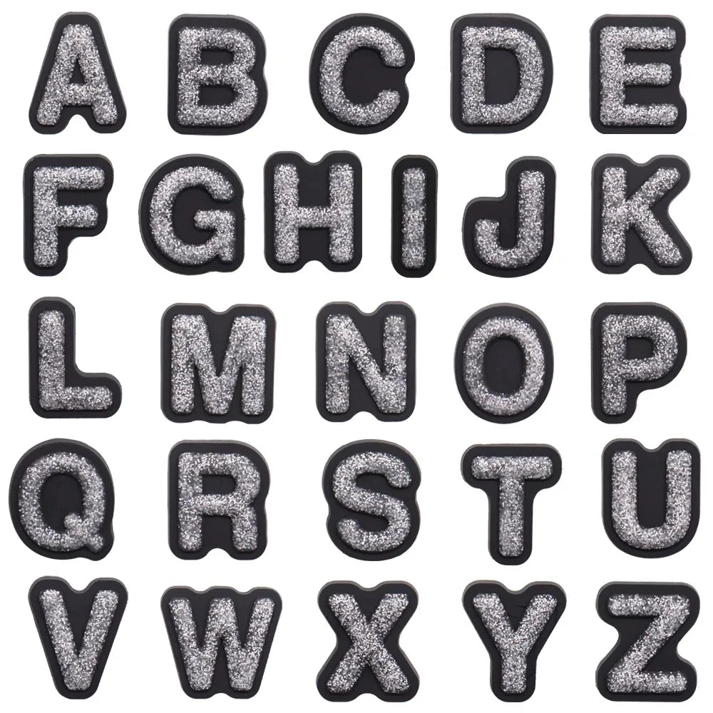 shoe charms Black and silver glittery letters A to Z on a white background
