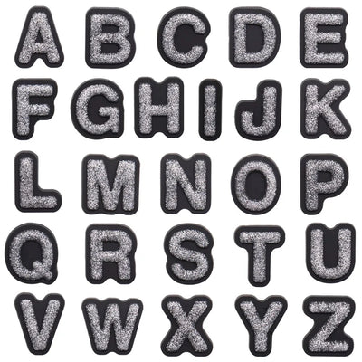 shoe charms Black and silver glittery letters A to Z on a white background