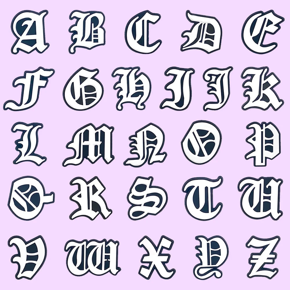shoe charms Alphabet letters in a decorative font on a light purple background
