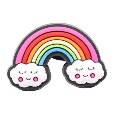 Rainbow-shaped charm with cloud ends on a white background