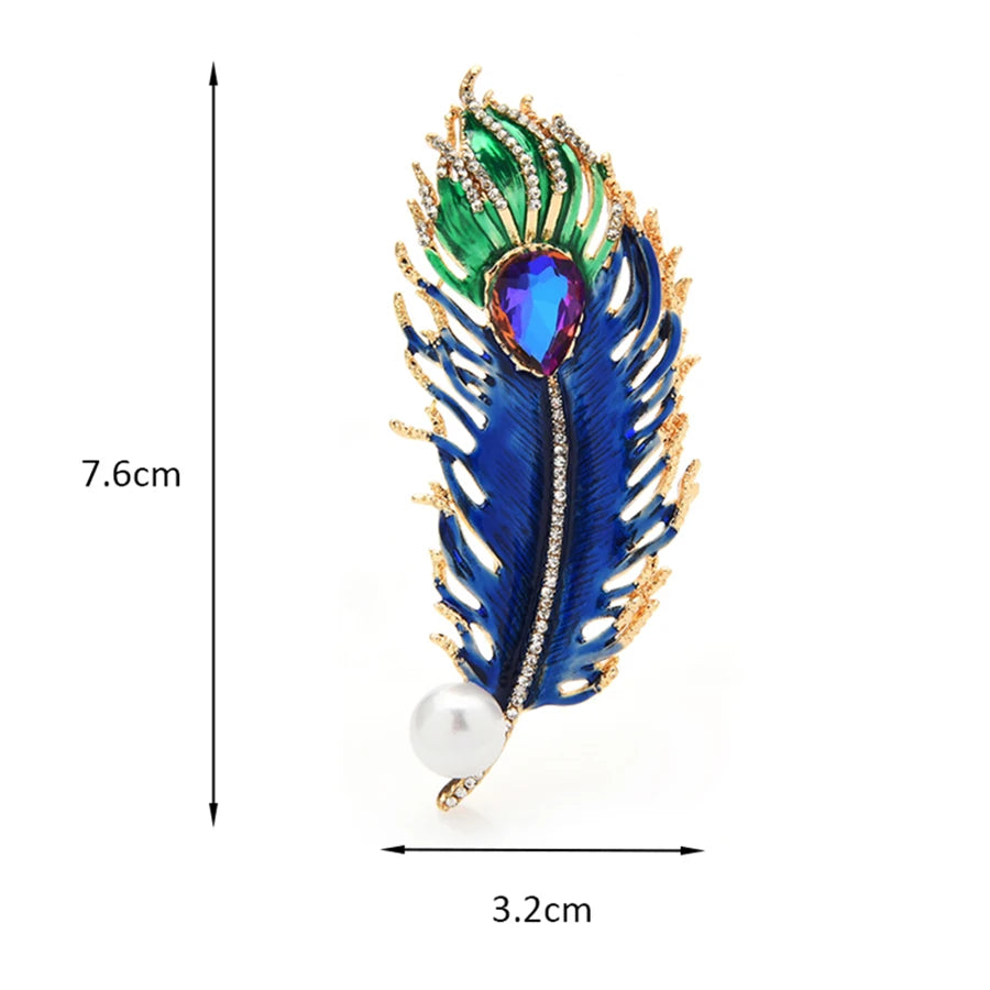 Colorful feather-shaped brooch with measurements on a white background