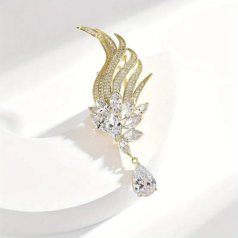 Gold and crystal earring on a white background