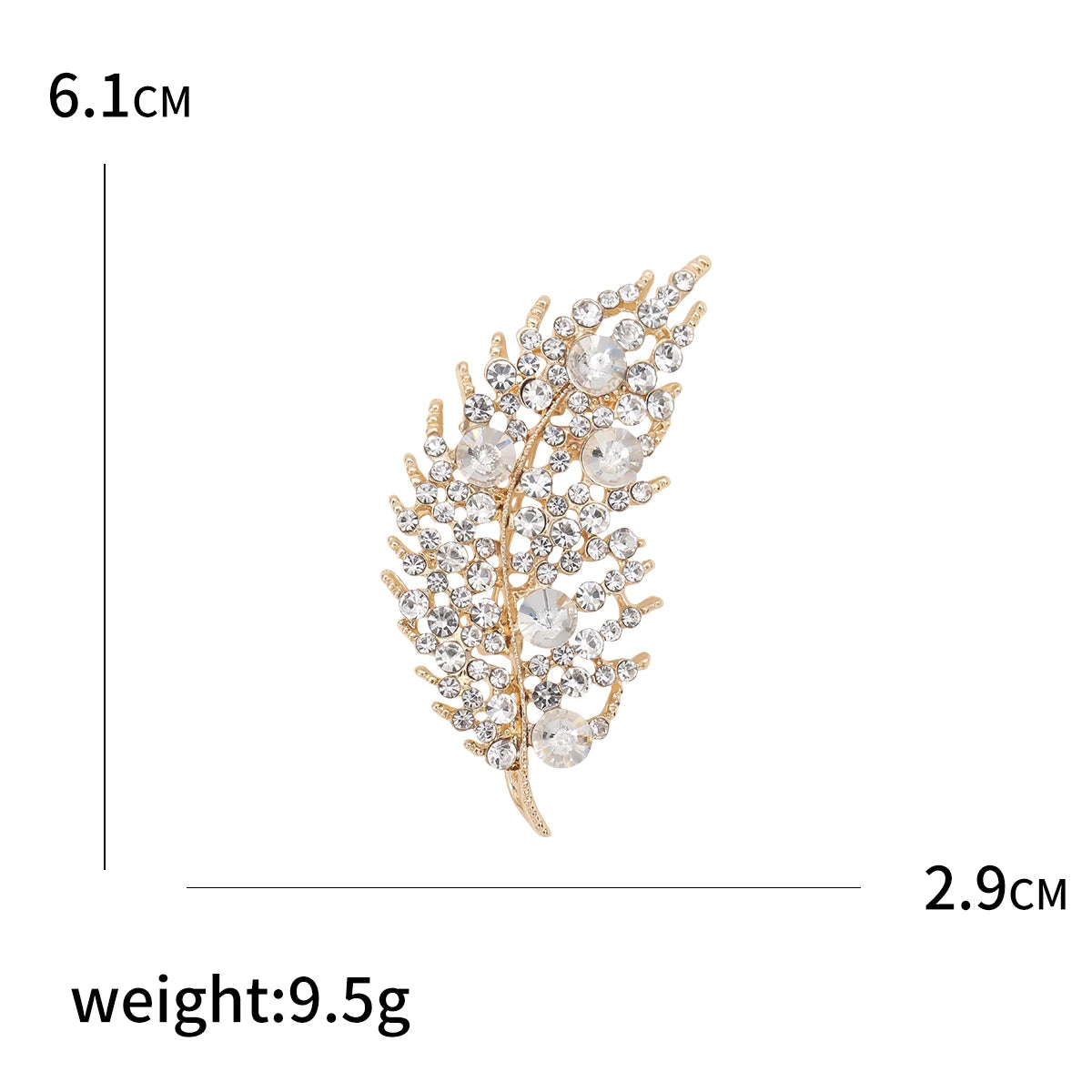 Gold and crystal leaf-shaped brooch with measurements and weight displayed.