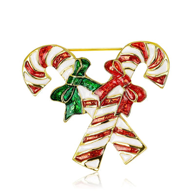 Christmas-themed brooch with candy canes and a bow on a white background