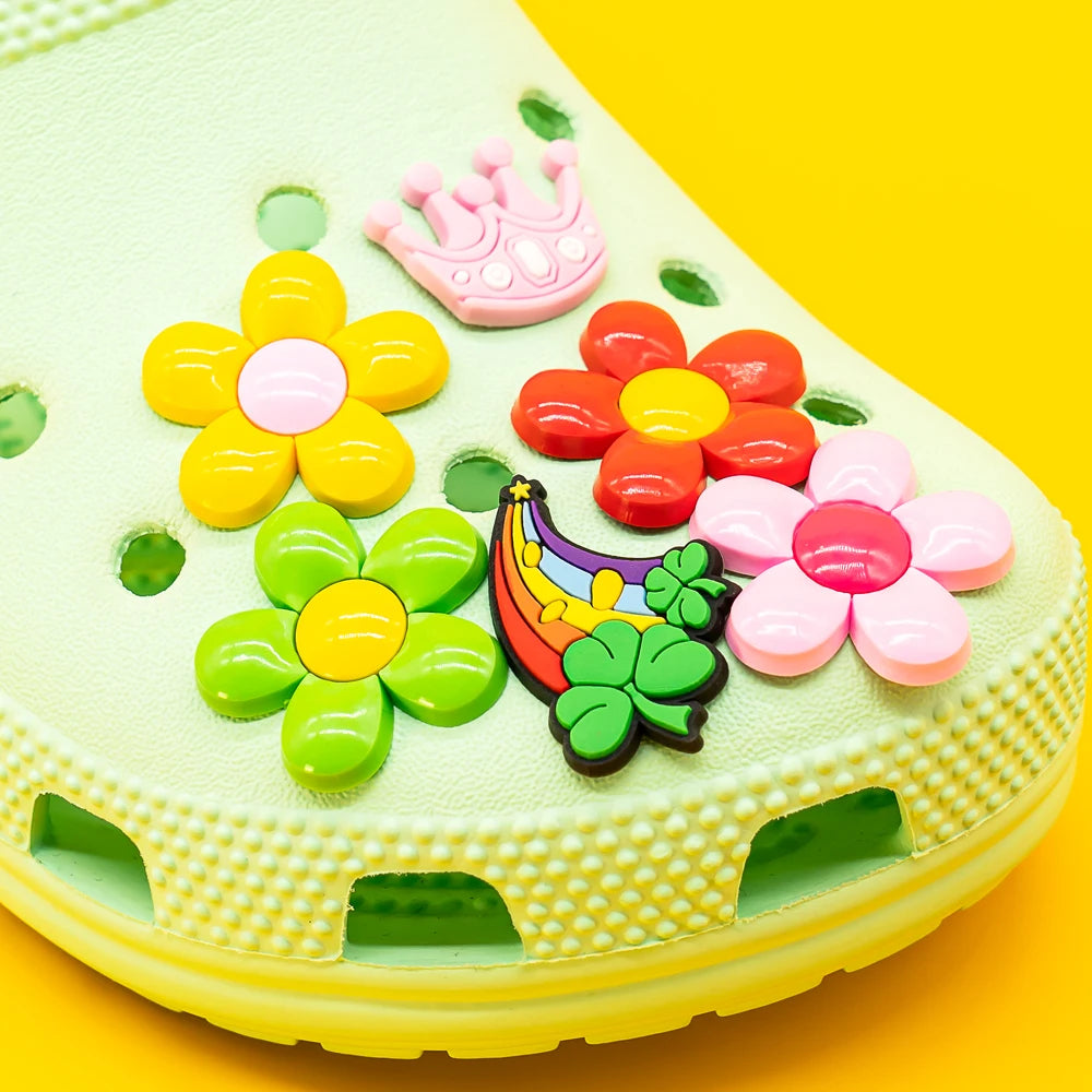 Colorful children's shoe with floral  shoe charms on a yellow background