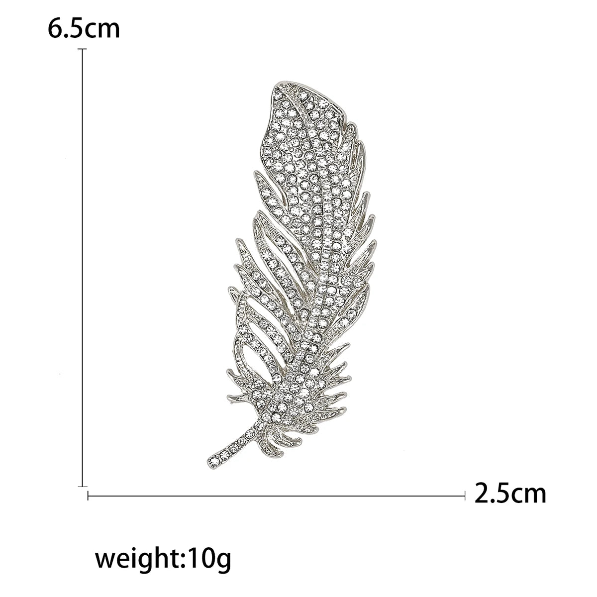 Feather-shaped brooch with gems and measurements and weight on a white background