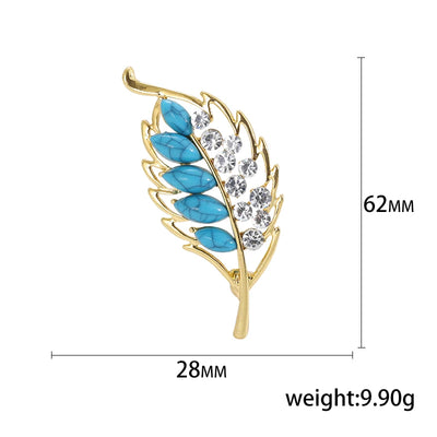 Jewelry brooch with blue stones and gold frame, shown with measurements and weight on a white background.