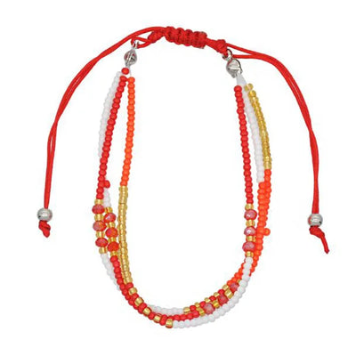 Multistrand beaded necklace with red, orange, yellow, and white beads on a red cord.