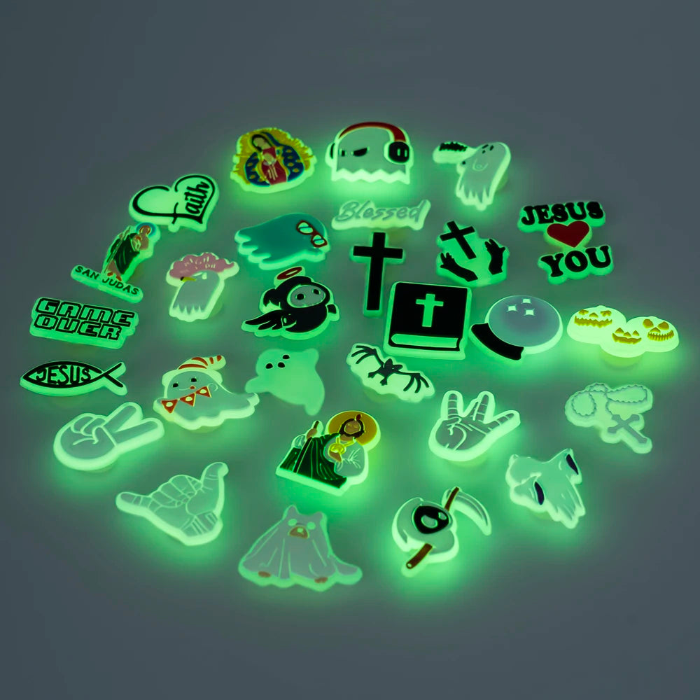 Glowing shoe charms with various designs on a dark background