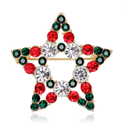 Star-shaped brooch with red and green gemstones on a white background