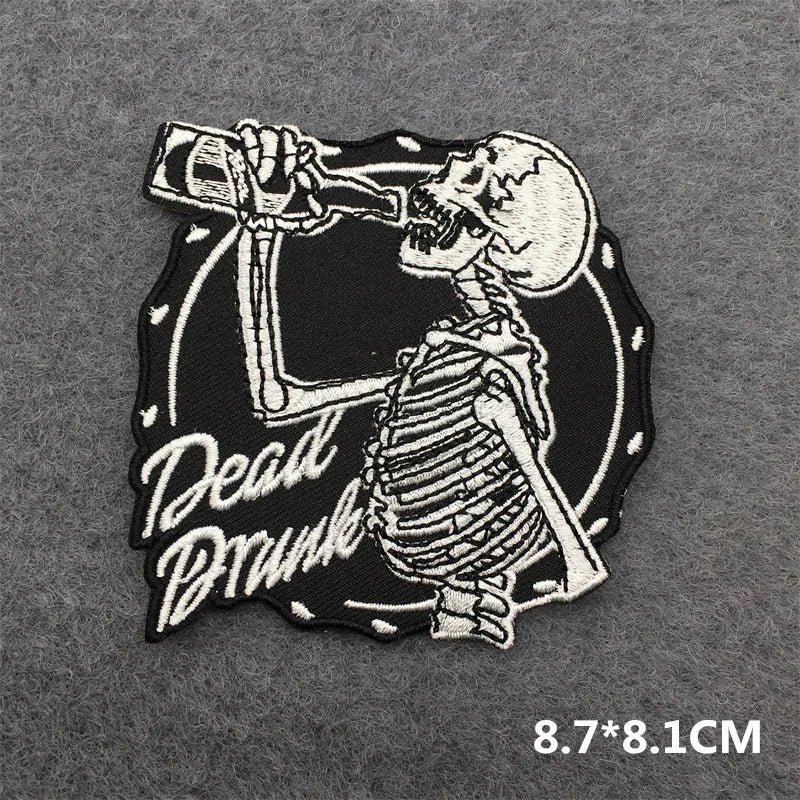 Skeleton patch drinking a bottle with 'Dead Drunk' text on a gray background
