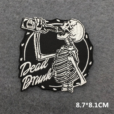 Skeleton patch drinking a bottle with 'Dead Drunk' text on a gray background
