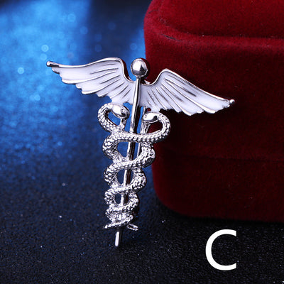 Silver caduceus medical symbol on a dark background