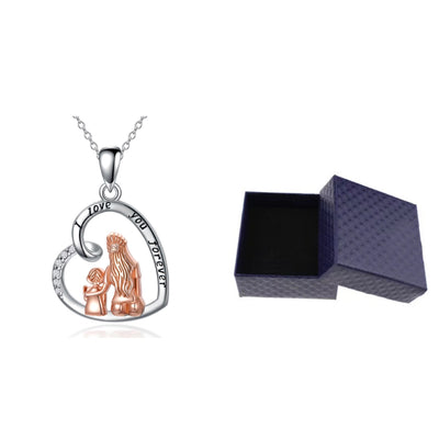 Heart-shaped pendant with a mother and daughter design and 'I love you' text, next to an open jewelry box on a white background.