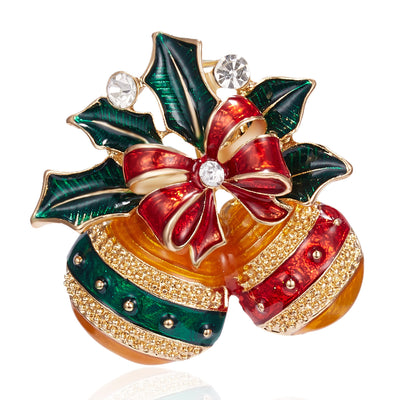Decorative brooch with holly leaves, red bow, and gold accents on a white background