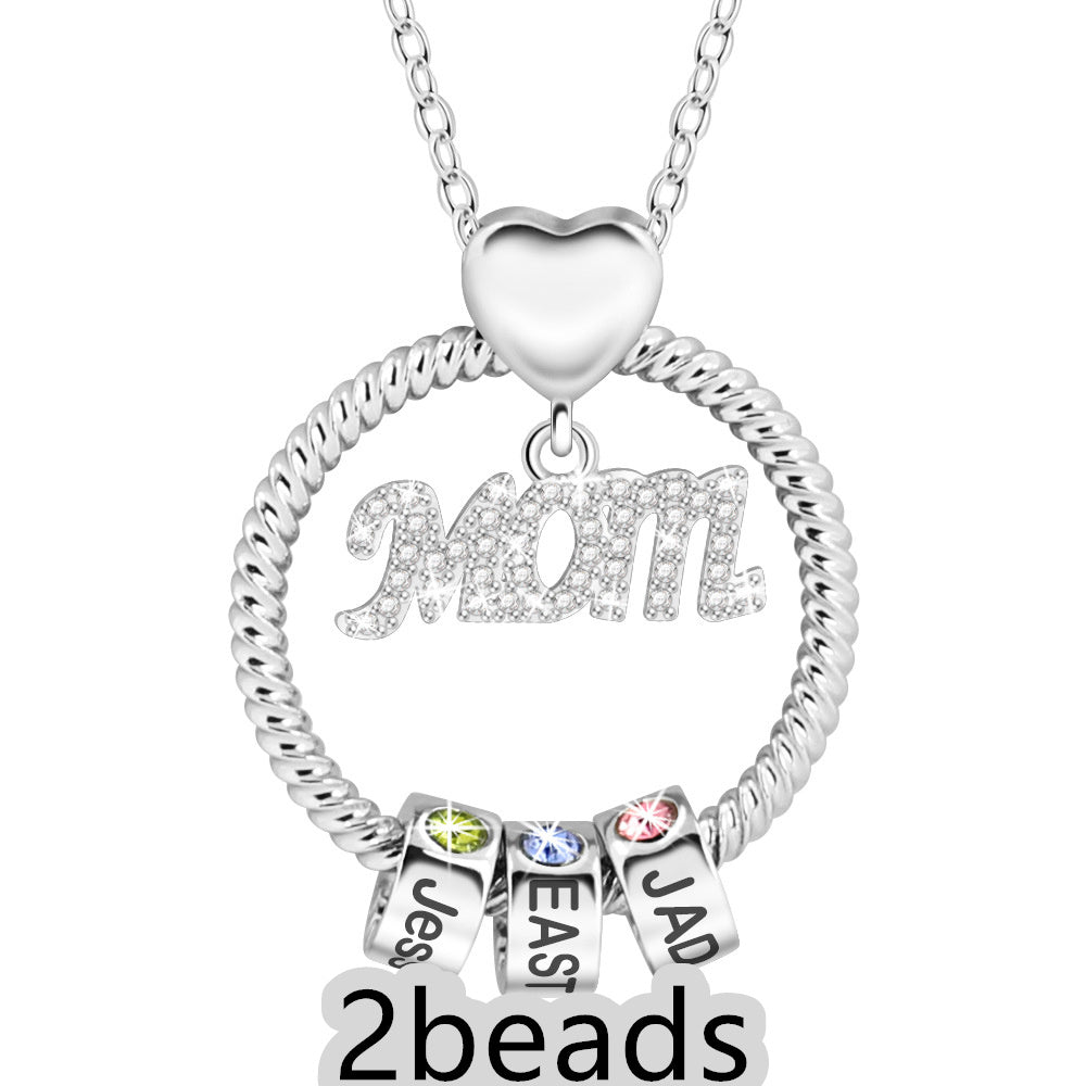 Silver necklace with 'Mom' pendant and three name charms on a white background 2  beads