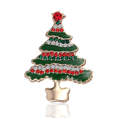 Christmas tree-shaped brooch with green, red, and gold colors on a white background