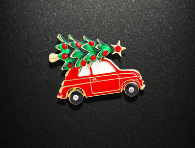 Red car with Christmas tree on a black background