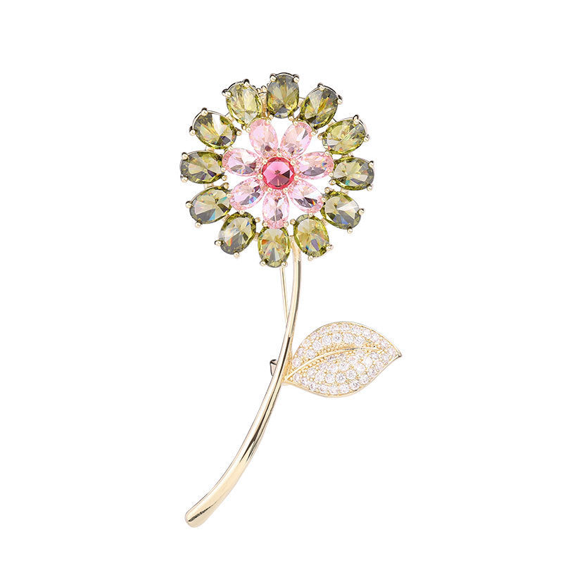 Decorative brooch with gemstones on a white background