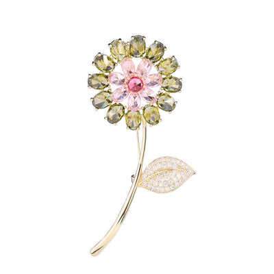 Decorative brooch with gemstones on a white background