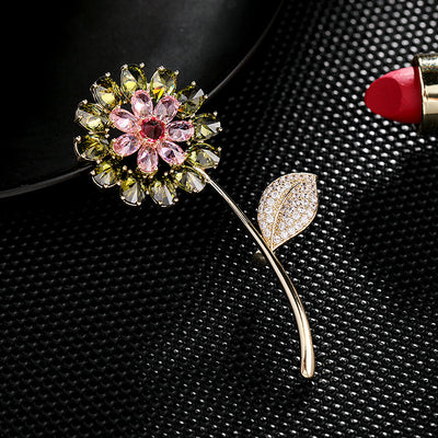 Decorative brooch with floral design on a textured black surface