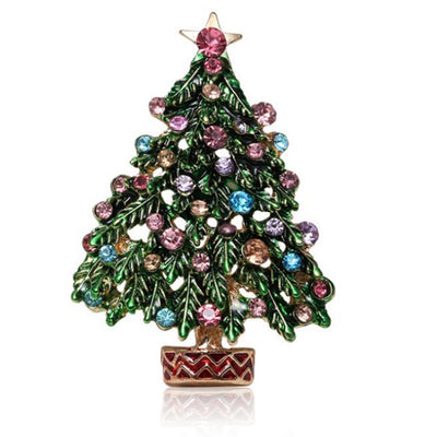 Decorative Christmas tree brooch with colorful gemstones on a white background