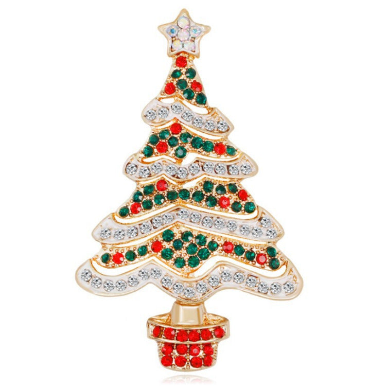 Christmas tree-shaped jewelry with red, green, and clear gemstones on a white background