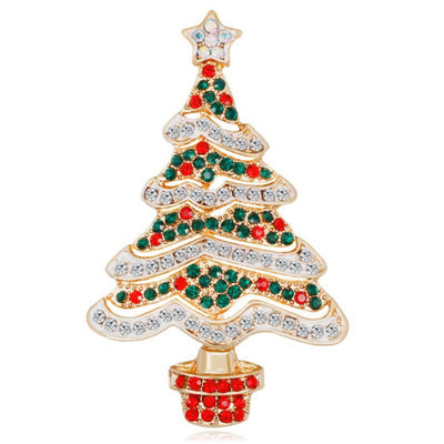 Christmas tree-shaped jewelry with red, green, and clear gemstones on a white background