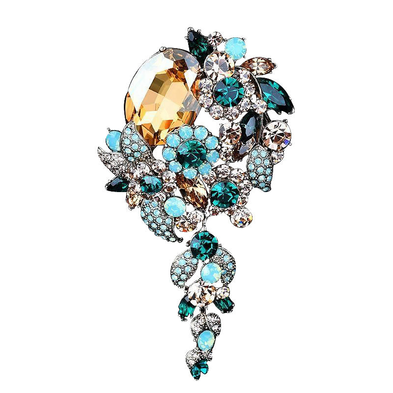 Decorative brooch with multicolored gemstones on a white background