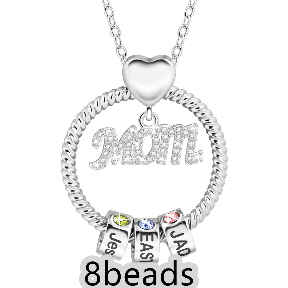 Silver necklace with 'Mom' pendant and name beads on a white background 8  beads