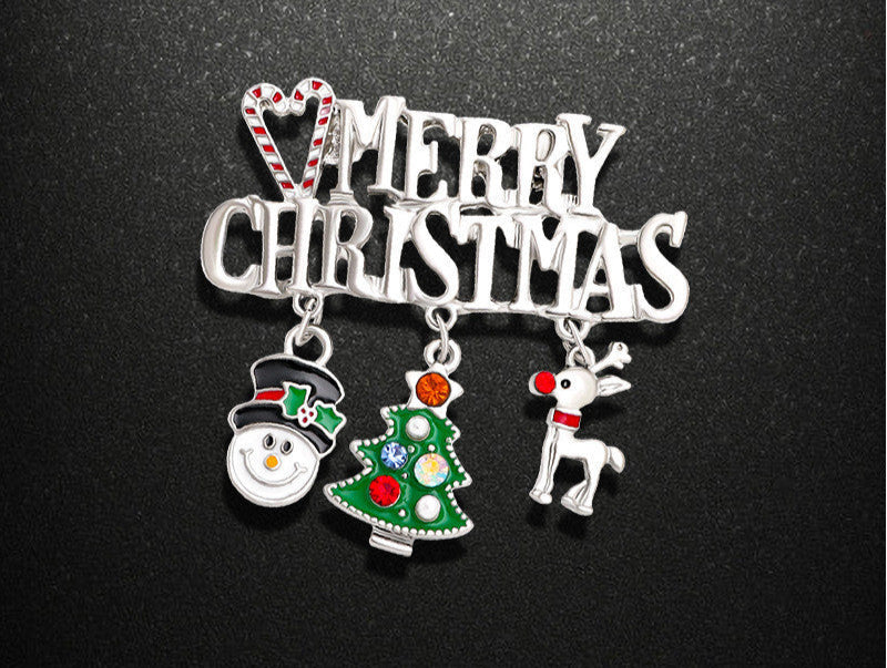 Christmas-themed brooch with snowman, tree, and reindeer charms on a black background