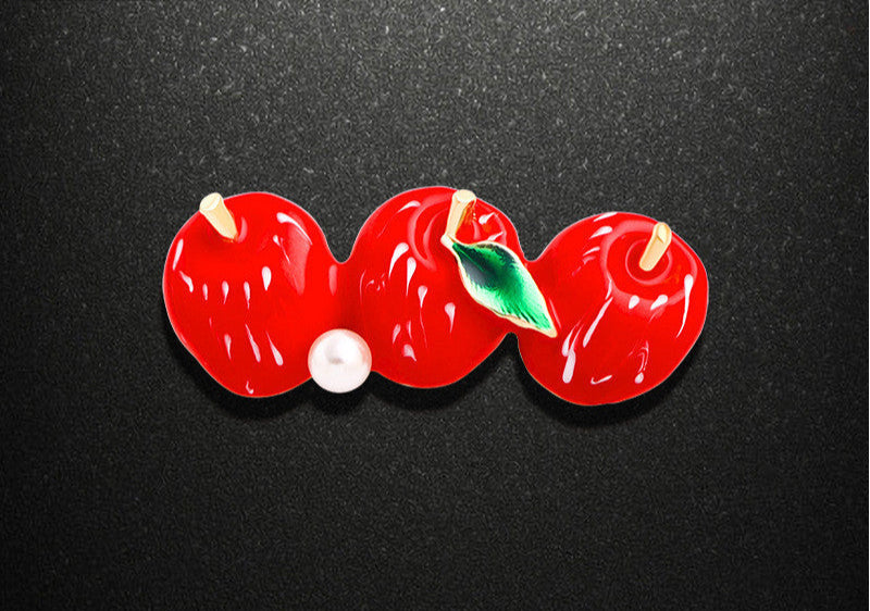 Red cherry-shaped object with measurements on a black background
