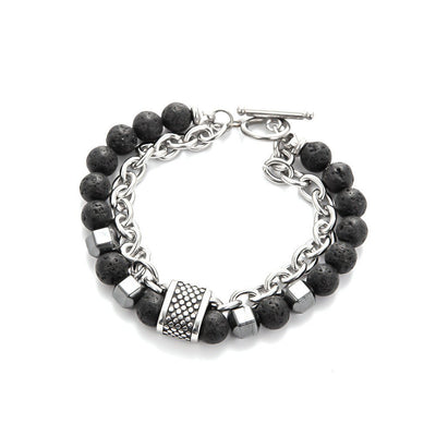 close up Bracelet with black beads and silver chain on a white surface