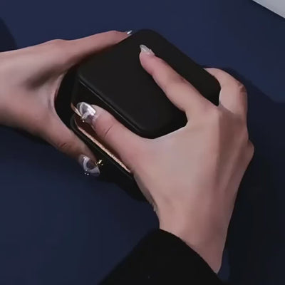 a video illustrating Silver feather-shaped brooch on a dark background